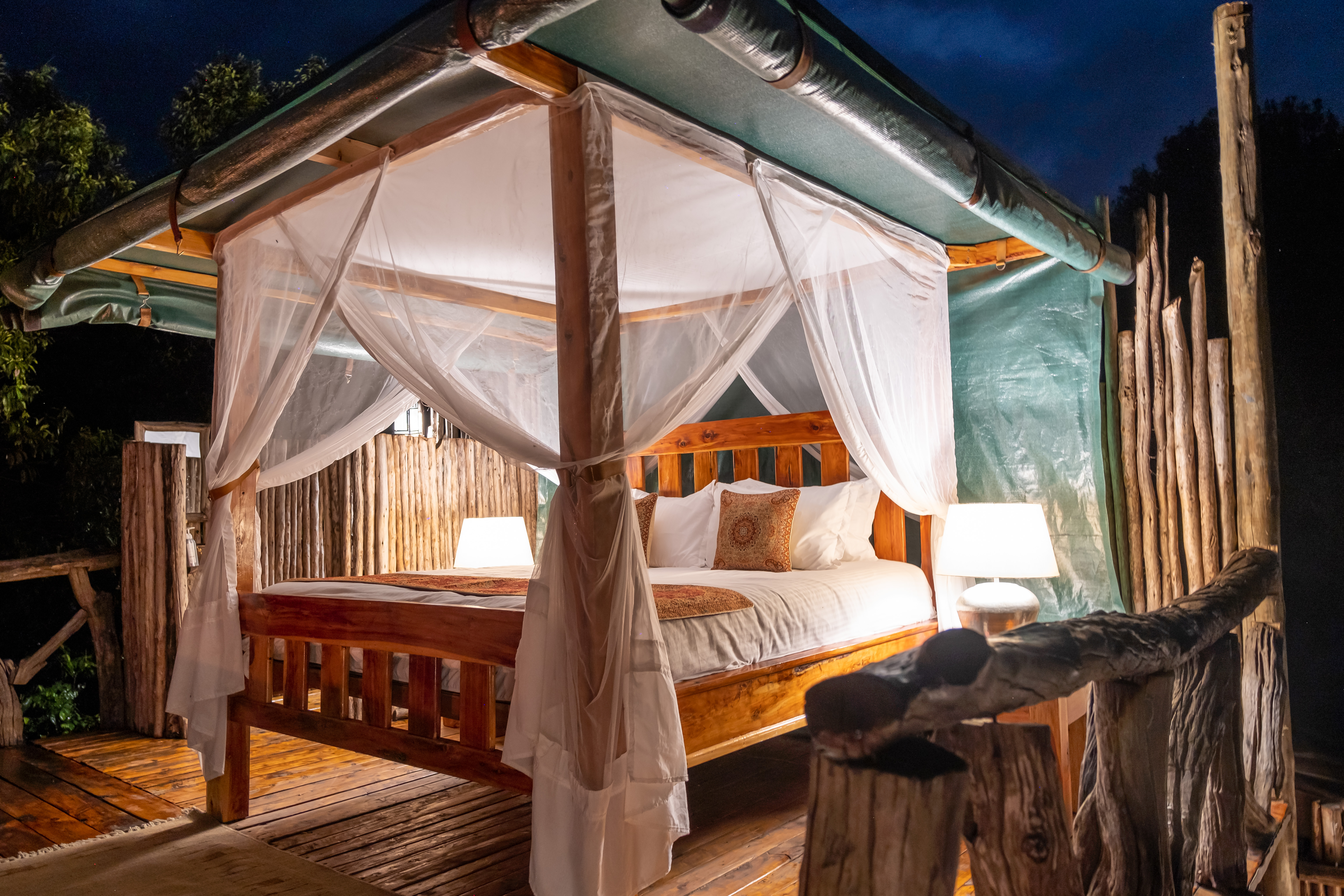 Deluxe tent exterior glowing at dusk from within